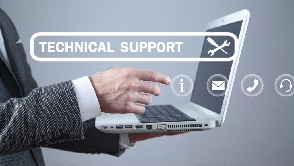 Business professional using laptop with technical IT support and managed service icons for UK business operations