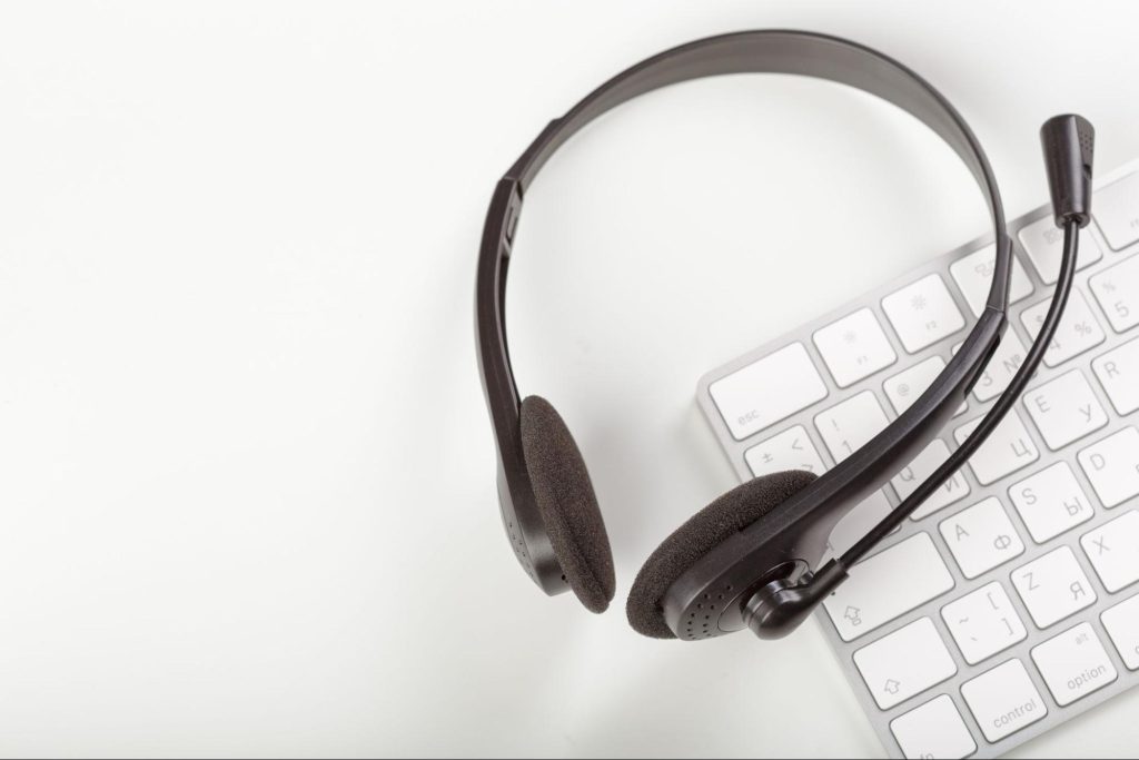 IT support headset and keyboard representing managed helpdesk and technical support services for UK businesses