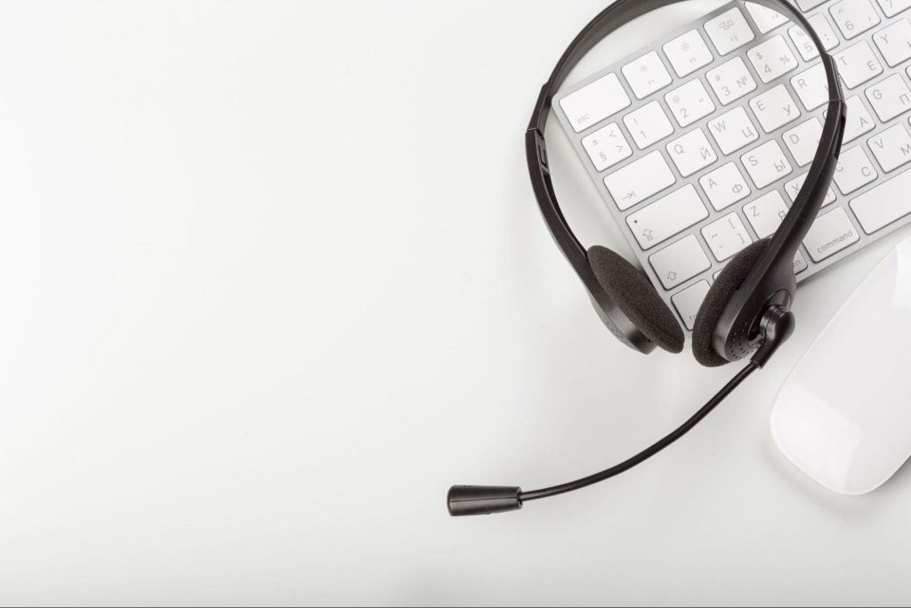 Headset and computer keyboard symbolising outsourced IT support and remote helpdesk services for UK companies